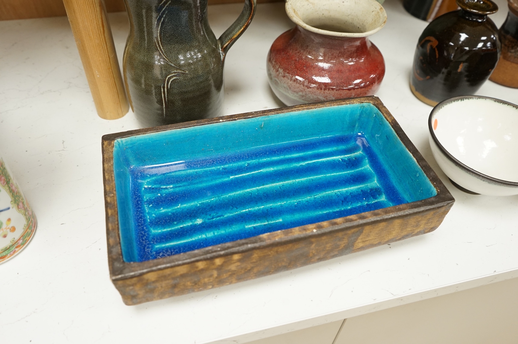 A group of eleven pieces of mixed 1960's-80's pottery to include vases, jugs and two rectangular dishes, largest 34cm high